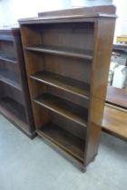 A tall early 20th Century oak open bookcase