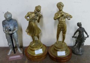 A pair of figures of musicians on wooden bases and two other figures of a lady and a knight