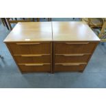 A pair of teak bedside chests