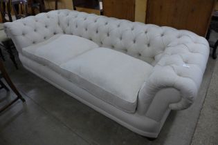 A Victorian style fabric upholstered Chesterfield settee