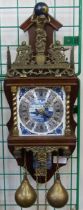 A Dutch mahogany and brass wall clock