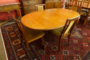 A G-Plan Fresco teak oval extending dining table and four chairs