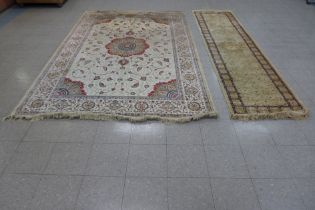 Two beige ground rugs