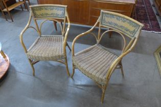 A pair of Italian bamboo and rattan elbow chairs