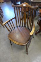 An Edward VII beech elbow chair