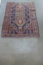 A Pakistani blue ground rug, 137 x 86cms