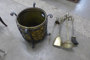 A brass and wrought steel coal bucket and a companion set