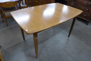 A teak rectangular extending dining table