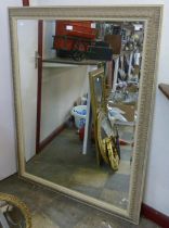 A large French style cream framed mirror