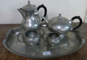 An Arts and Crafts pewter coffee set with tray