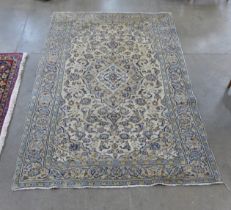 An eastern cream ground rug, 235 x 142cms