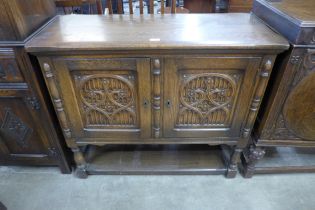 A 17th Century carved oak two door livery cupboard