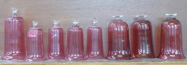 Eight cranberry glass bell top domes **PLEASE NOTE THIS LOT IS NOT ELIGIBLE FOR POSTING AND