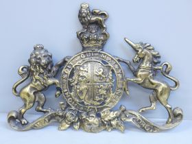 A Victorian brass Royal Coat of Arms plaque, 28cm