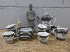 A Japanese six setting tea set, sugar pot lacking lid, a Chinese terracotta warrior and a