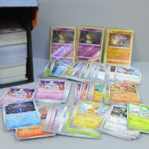 Over 500 assorted Pokemon cards in ETB box, some shiny cards