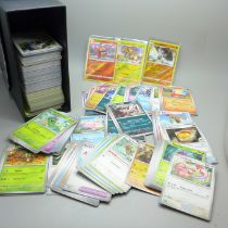 Over 500 assorted Pokemon cards in ETB box, some shiny cards