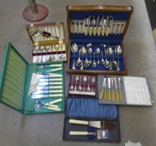 A canteen of cutlery and other boxed flatware