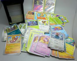 Over 500 assorted Pokemon cards in ETB box, some shiny cards