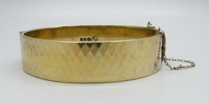 A 22ct gold on silver bangle, 43g