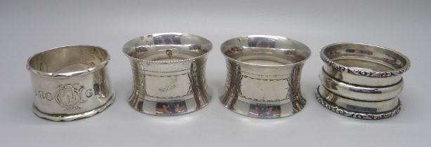 A pair of silver napkin rings and two other silver napkin rings, 124g