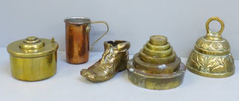 A copper stirrup cup, brass weights and other brass items