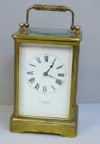 A heavy brass carriage clock, A.J. Wright, Paris, Maltese Cross winding protection, strikes on gong,