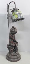 A figural table lamp with glass shade, 54cm
