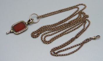 A Victorian long guard chain and an antique watch key/fob