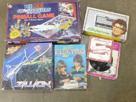 A Ghostbuster battery operated Pinball Game, a Matchbox Action Zillion white light beam game, Rolf