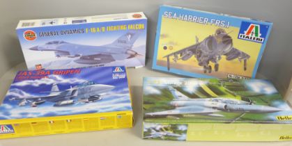 Four model kits, Sea Harrier, Fighting Falcon and two others