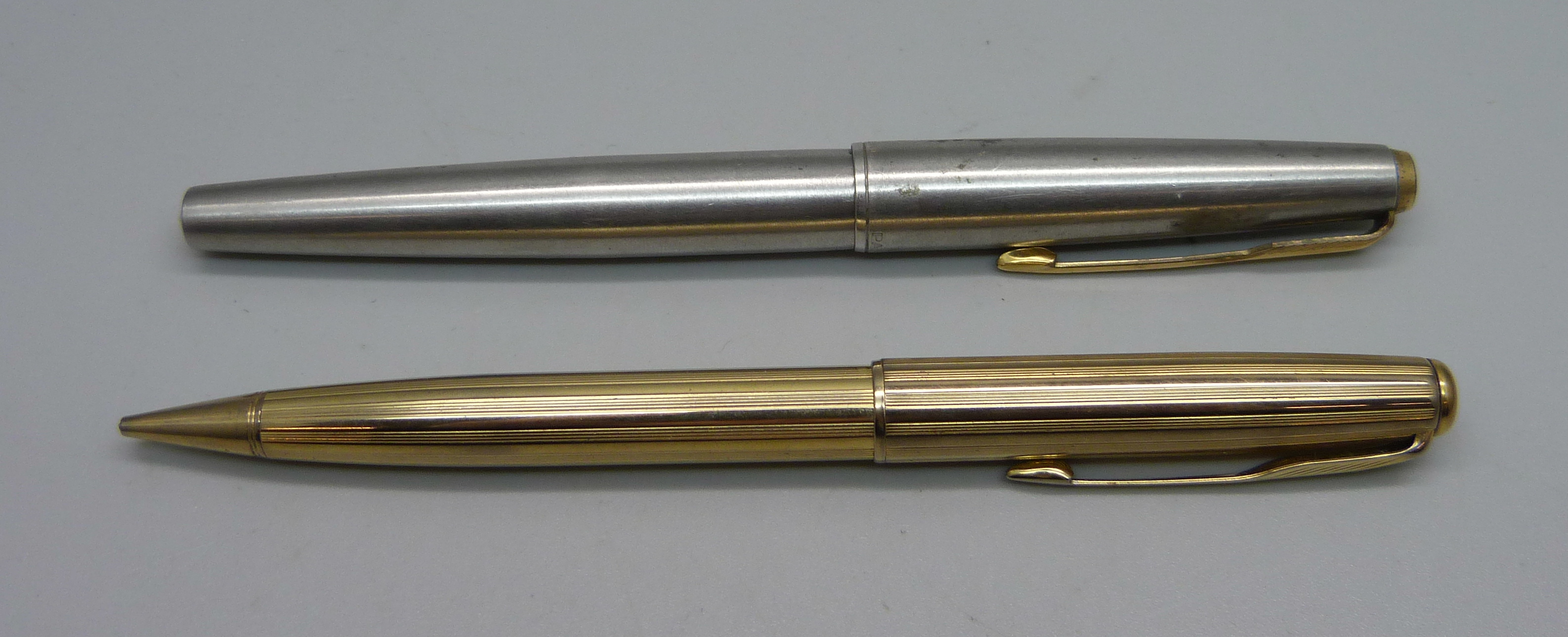 A Parker pen, barrel engraved, a/f and a Parker Sonnet pencil in gold plated casing