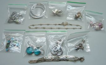 Ten pairs of silver earrings and two 925 silver bracelets