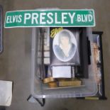 A box of Elvis Presley memorabilia, including a four-tiled picture, books, plates, number plate