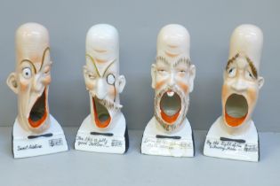A set of four figural singing head ash trays