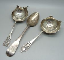 Two silver tea strainers and an Irish silver spoon, 122g