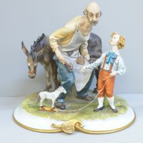 A Neopolitan figure of a farrier and boy
