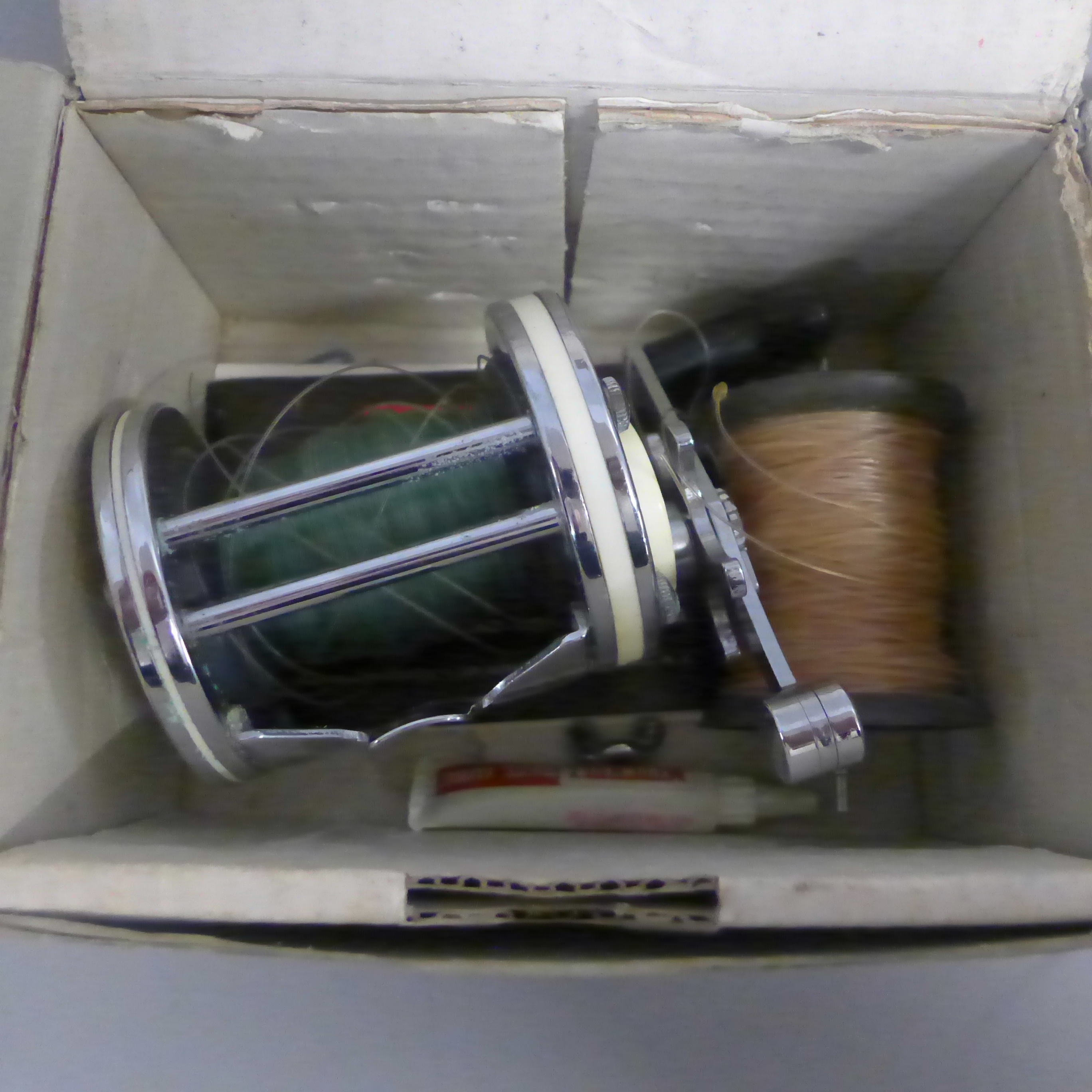 Two fishing reels; Mitchell Garcia 6001A and one other Bakelite and metal marked 'Made in Australia' - Image 2 of 2