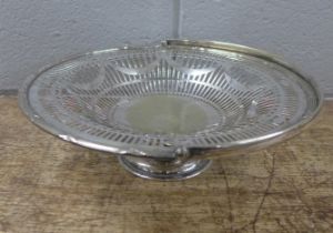 A silver plated pierced cake stand with handle