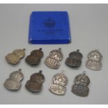 Nine WWII Air Raid Precautions (ARP) silver badges, 82g