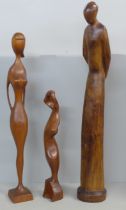 Three carved figures, one a/f, one signed M. Khumalo, 1976