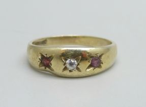 A 9ct gold ring set with two garnets and a white stone, 1.7g, J/K