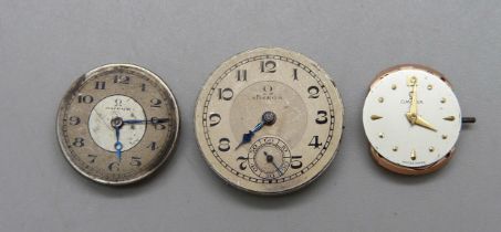 Three Omega wristwatch movements