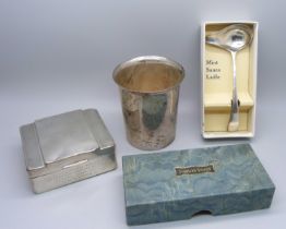 A silver christening cup, London 1914, 125g, a silver mint sauce ladle, Sheffield 1939, 28g and a