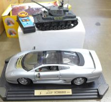 A radio controlled battery operated Tiger Tank, EM-315, boxed and a Maisto Jaguar XD220, boxed