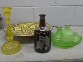 A Moroccan large shallow bowl, a brown glass bottle embellished with leaves, a lemon yellow glass