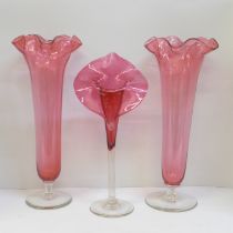 A pair of cranberry glass vases, 36cm and a Jack in the Pulpit cranberry glass vase **PLEASE NOTE