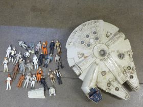 A collection of Star Wars figures and a Millennium Falcon