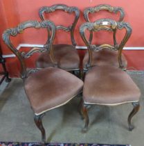 A set of four Victorian walnut dining chairs