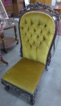 A Victorian rosewood and upholstered nursing chair